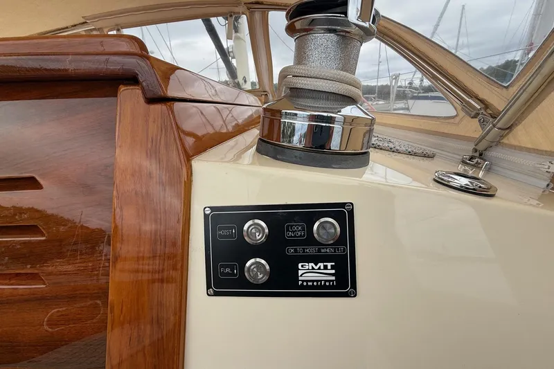 Slide: The Image of Control panel on a 2015 Hinckley DS 42 sailboat with wooden and chrome details. - 47