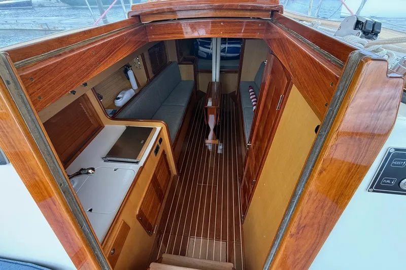 Slide: The Image of Interior of 2015 Hinckley DS 42 sailboat with wooden finishes and compact layout. - 48