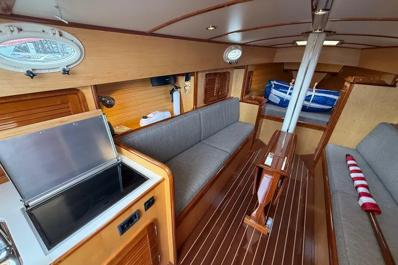 Slide: The Image of Interior of 2015 Hinckley DS 42 sailboat with wood finish and modern amenities. - 52