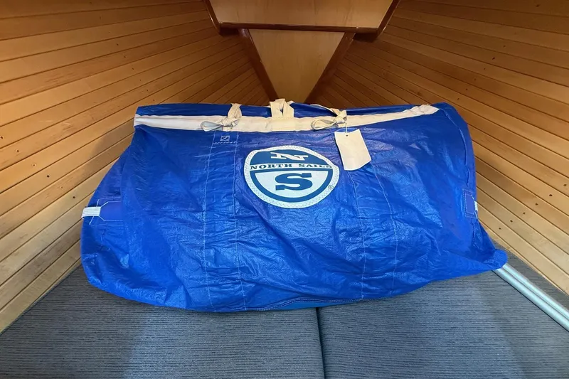 Slide: The Image of Blue North Sails bag inside 2015 Hinckley DS 42 boat cabin with wooden paneling. - 59