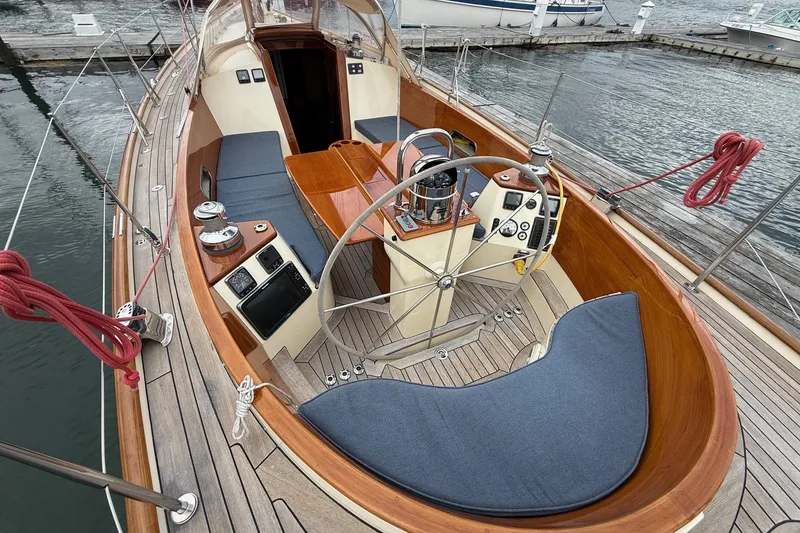 Slide: The Image of 2015 Hinckley DS 42 sailboat cockpit with wooden deck and steering wheel. - 6