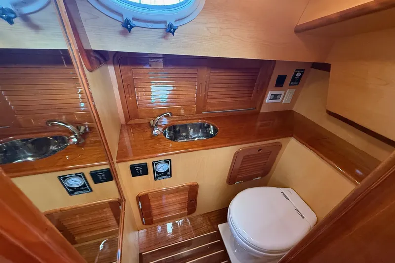 Slide: The Image of Luxurious wooden bathroom interior of 2015 Hinckley DS 42 yacht with sink and toilet. - 65
