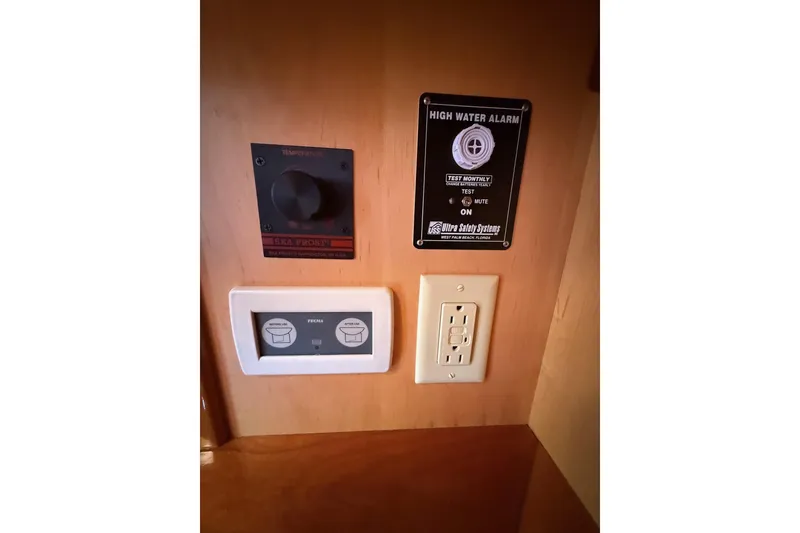 Slide: The Image of Control panel and high water alarm on 2015 Hinckley DS 42 yacht interior. - 67