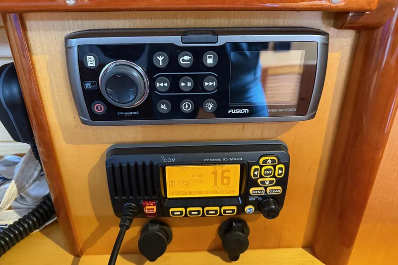 Slide: The Image of Hinckley DS 42 2015 boat dashboard with Fusion and Icom marine radios. - 72