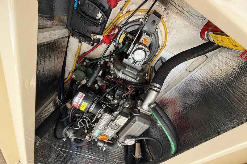 Slide: The Image of Engine compartment of a 2015 Hinckley DS 42 boat, showcasing mechanical components. - 79