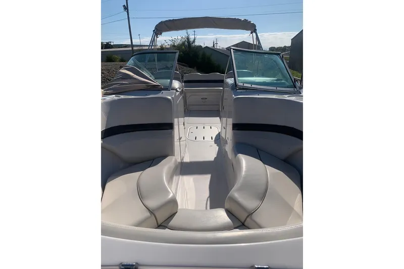 Slide: The Image of 2003 Four Winns 240 Horizon boat interior with seating and windshield. - 11