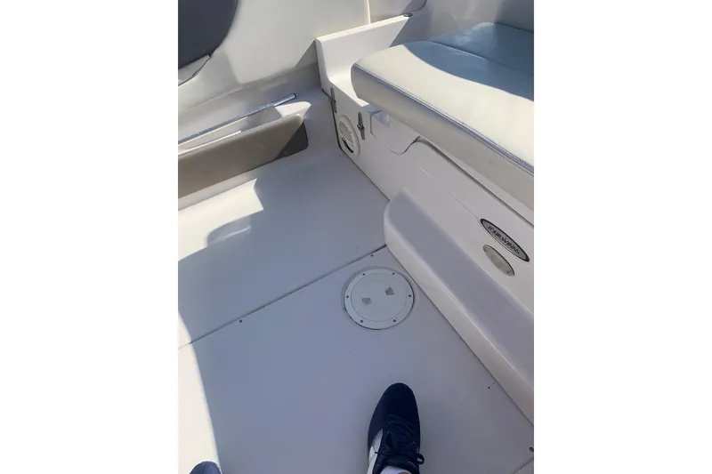 Slide: The Image of Interior of a 2003 Four Winns 240 Horizon boat, featuring seating and deck details. - 18