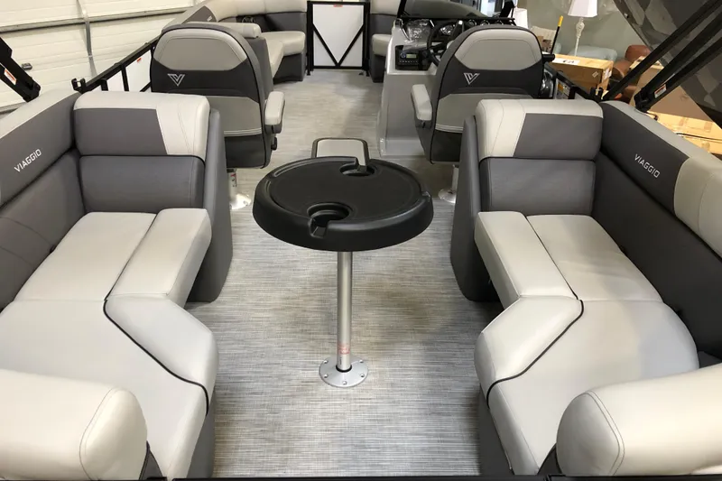 Slide: The Image of Interior of 2026 Viaggio V22U pontoon boat with gray seating and central table. - 5