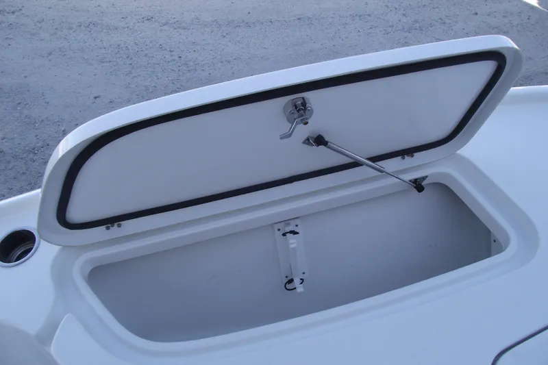 Slide: The Image of Open storage compartment on 2019 Sea Hunt BX 22 BR boat. - 12