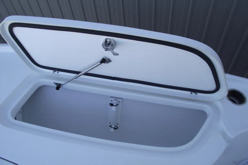 Slide: The Image of Open storage compartment on 2019 Sea Hunt BX 22 BR boat. - 14
