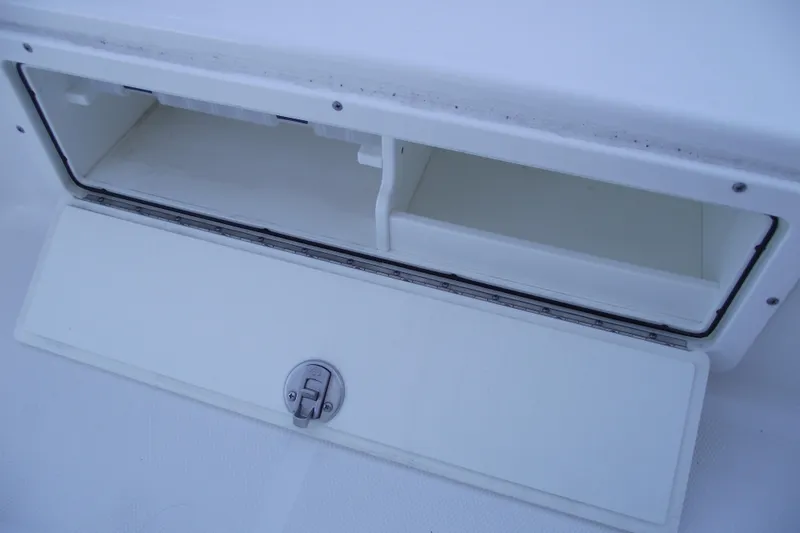 Slide: The Image of 2019 Sea Hunt BX 22 BR boat storage compartment with open hatch. - 16