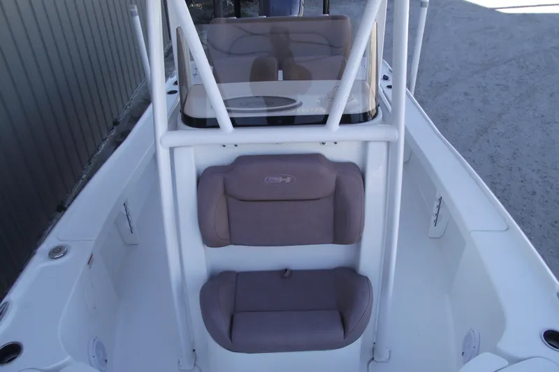 Slide: The Image of 2019 Sea Hunt BX 22 BR boat interior with cushioned seating and console. - 17