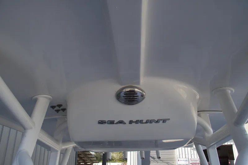 Slide: The Image of 2019 Sea Hunt BX 22 BR boat T-top with logo and speaker. - 18