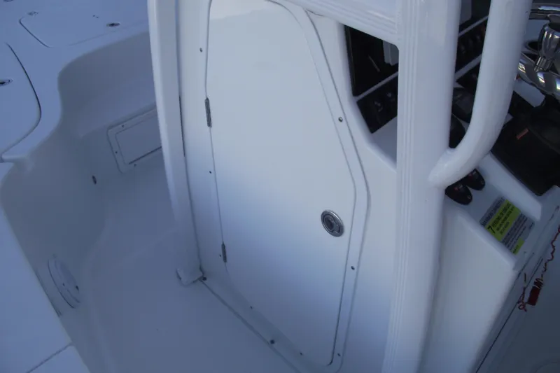 Slide: The Image of 2019 Sea Hunt BX 22 BR boat interior with console door and controls. - 21
