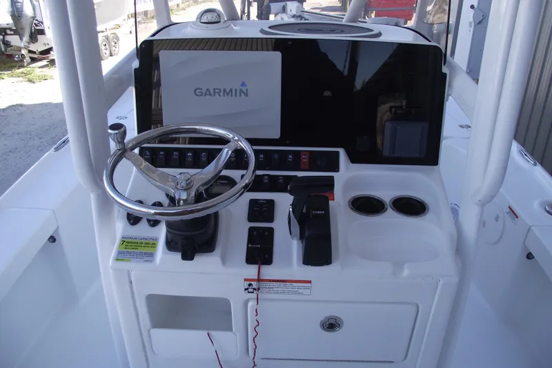 Slide: The Image of 2019 Sea Hunt BX 22 BR boat console with Garmin navigation system and steering wheel. - 25