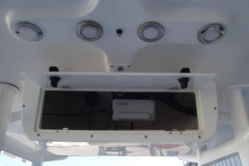Slide: The Image of 2019 Sea Hunt BX 22 BR boat console with storage compartment and lighting fixtures. - 27