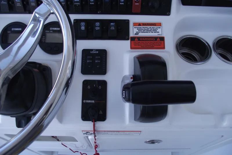 Slide: The Image of 2019 Sea Hunt BX 22 BR boat dashboard with Yamaha controls and warning labels. - 29