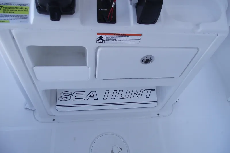 Slide: The Image of 2019 Sea Hunt BX 22 BR boat console with storage and controls. - 31