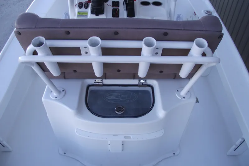 Slide: The Image of 2019 Sea Hunt BX 22 BR boat interior with rod holders and storage compartment. - 34