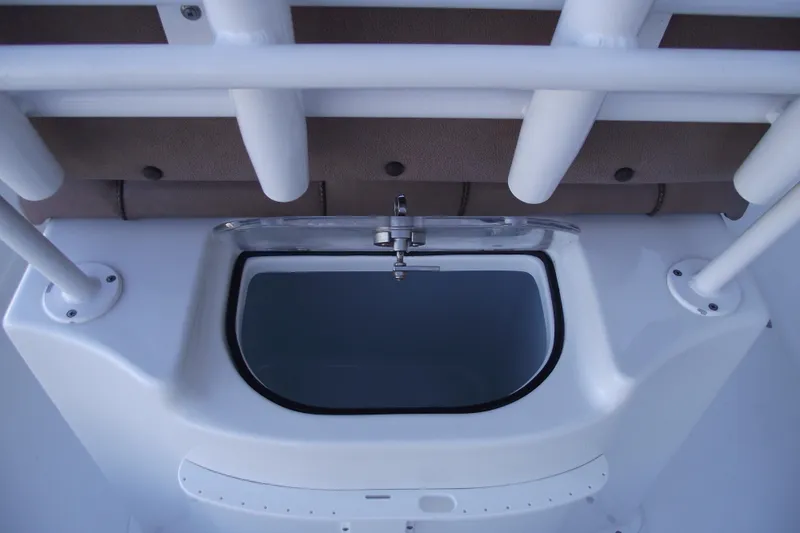 Slide: The Image of 2019 Sea Hunt BX 22 BR boat interior with rod holders and storage compartment. - 35