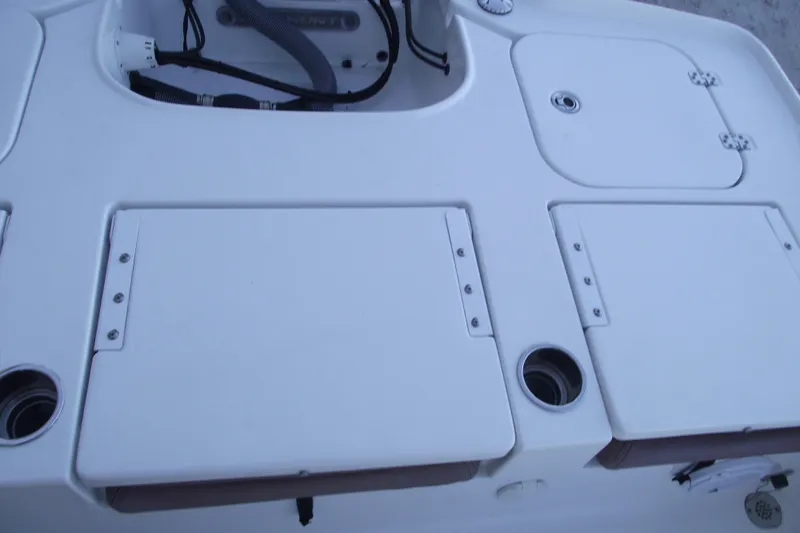 Slide: The Image of 2019 Sea Hunt BX 22 BR boat deck with storage compartments and cup holders. - 36