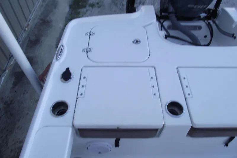 Slide: The Image of 2019 Sea Hunt BX 22 BR boat deck with storage compartments and cup holders. - 38