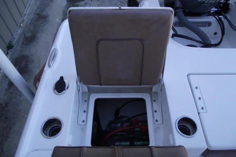 Slide: The Image of 2019 Sea Hunt BX 22 BR boat interior with storage compartment and cup holders. - 40
