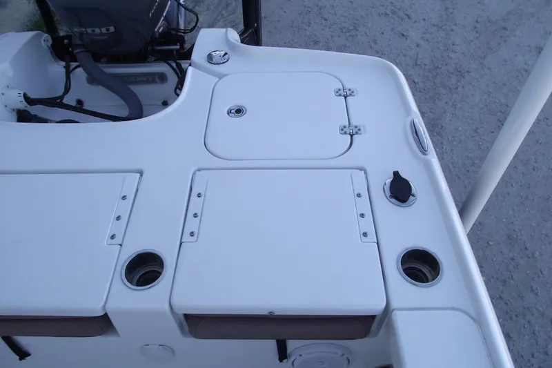 Slide: The Image of 2019 Sea Hunt BX 22 BR boat deck with storage compartments and motor. - 41
