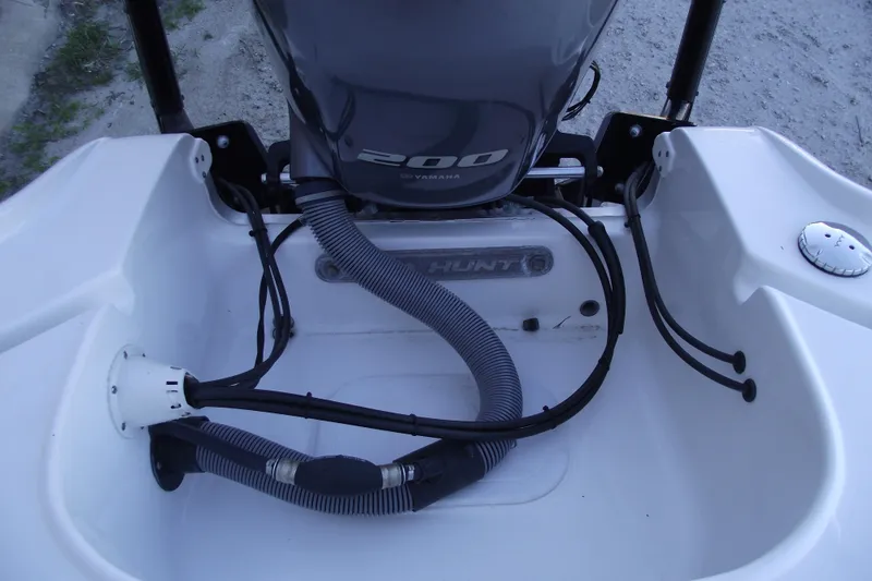 Slide: The Image of 2019 Sea Hunt BX 22 BR boat engine compartment with Yamaha 200 outboard motor. - 45