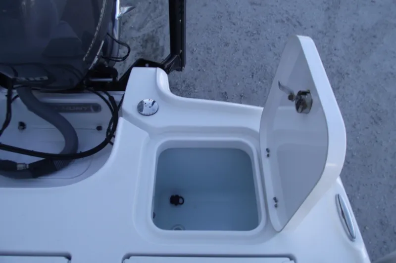 Slide: The Image of 2019 Sea Hunt BX 22 BR boat storage compartment with open lid and visible interior. - 46