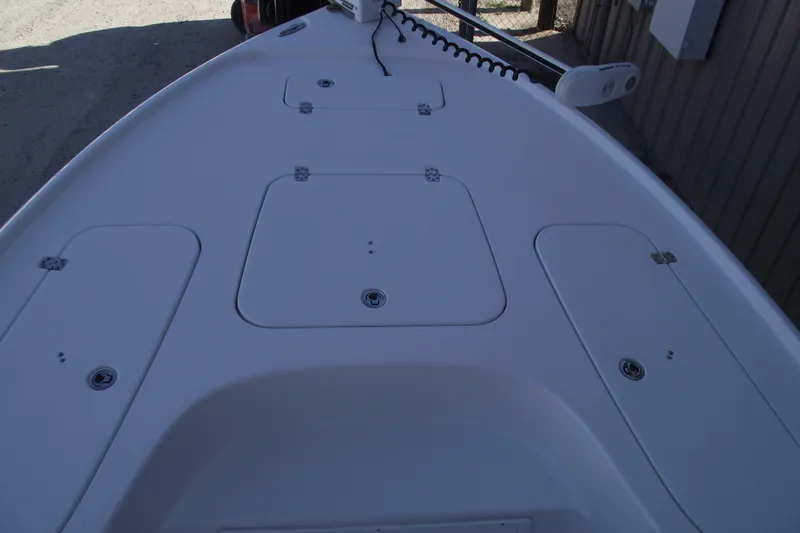 Slide: The Image of 2019 Sea Hunt BX 22 BR boat deck with storage compartments and trolling motor. - 5
