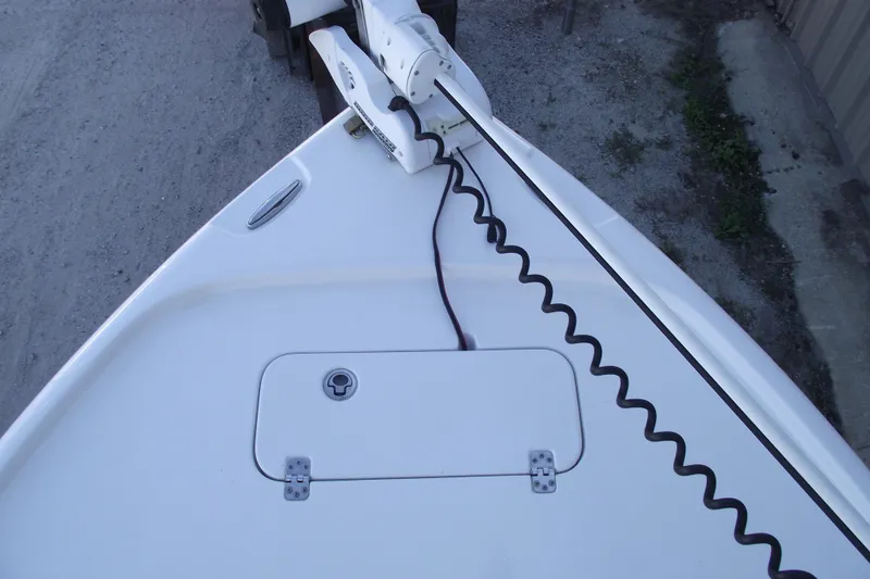 Slide: The Image of 2019 Sea Hunt BX 22 BR boat bow with trolling motor and storage hatch. - 6