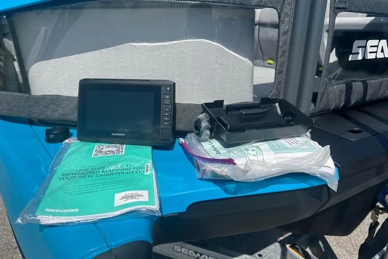 Slide: The Image of 2023 Sea-Doo Switch Cruise 21 with Garmin device and chartplotter setup on blue deck. - 16
