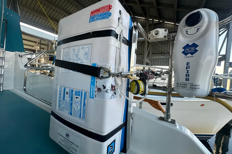 Slide: The Image of Safety equipment on 1972 Tollycraft 42 Tri-Cabin, featuring EPIRB and Crewsaver liferaft. - 16