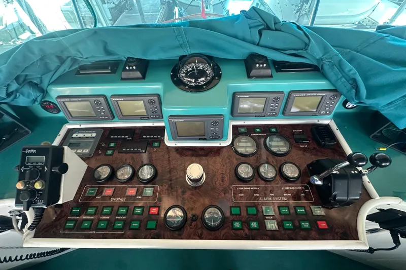 Slide: The Image of 1972 Tollycraft 42 Tri-Cabin helm with navigation instruments and control panel. - 18