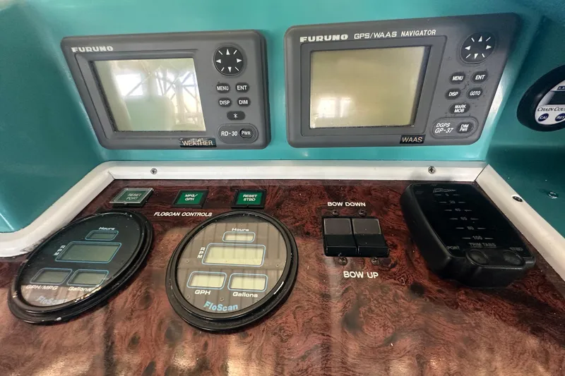 Slide: The Image of Control panel of a 1972 Tollycraft 42 Tri-Cabin with navigation and fuel gauges. - 20