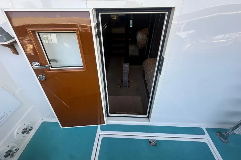 Slide: The Image of 1972 Tollycraft 42 Tri-Cabin boat interior view through open door. - 26