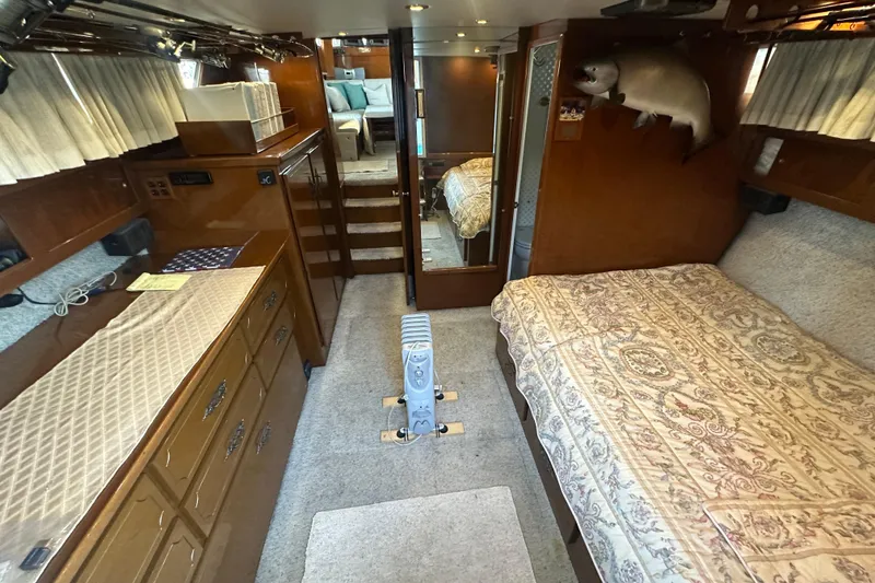 Slide: The Image of Interior of 1972 Tollycraft 42 Tri-Cabin with wood paneling and cozy furnishings. - 27