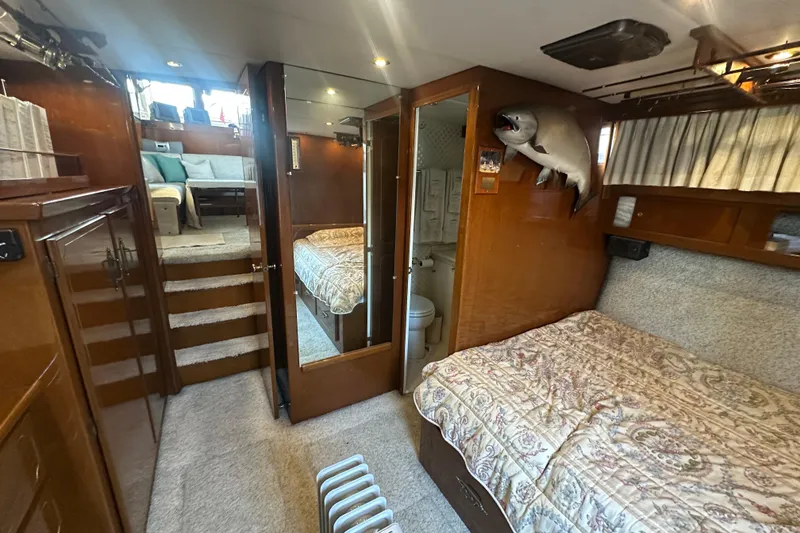 Slide: The Image of 1972 Tollycraft 42 Tri-Cabin interior with cozy bedroom and bathroom. - 31