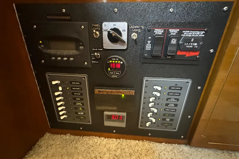 Slide: The Image of Electrical control panel of a 1972 Tollycraft 42 Tri-Cabin boat. - 44