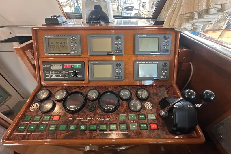 Slide: The Image of Control panel of a 1972 Tollycraft 42 Tri-Cabin boat with navigation instruments. - 45