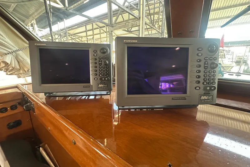 Slide: The Image of Furuno navigation displays on 1972 Tollycraft 42 Tri-Cabin yacht dashboard. - 46