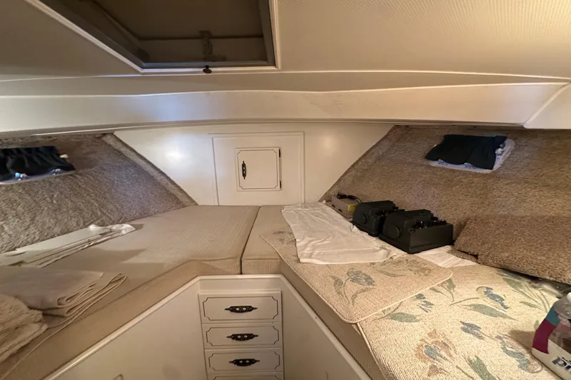 Slide: The Image of 1972 Tollycraft 42 Tri-Cabin interior with cozy twin beds and storage drawers. - 52