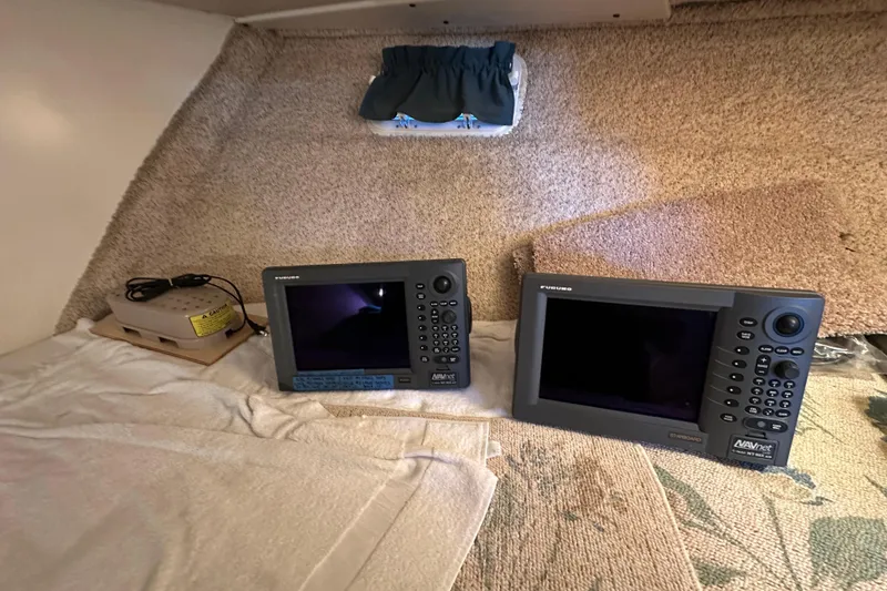 Slide: The Image of Navigation equipment inside a 1972 Tollycraft 42 Tri-Cabin boat cabin. - 53