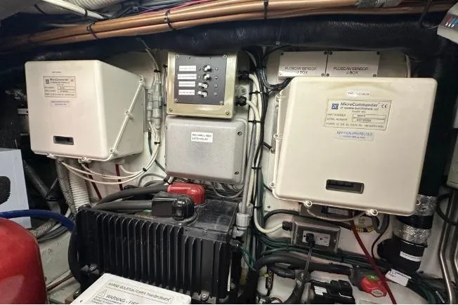 Slide: The Image of Engine room of 1972 Tollycraft 42 Tri-Cabin with electrical components and wiring. - 54