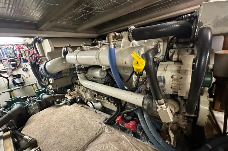 Slide: The Image of Engine room of 1972 Tollycraft 42 Tri-Cabin with visible machinery and components. - 64