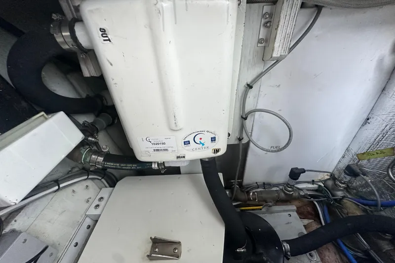 Slide: The Image of Engine compartment of a 1972 Tollycraft 42 Tri-Cabin with fuel system components. - 66