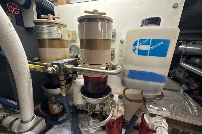 Slide: The Image of Engine room of 1972 Tollycraft 42 Tri-Cabin with fuel filters and Cummins Marine container. - 67