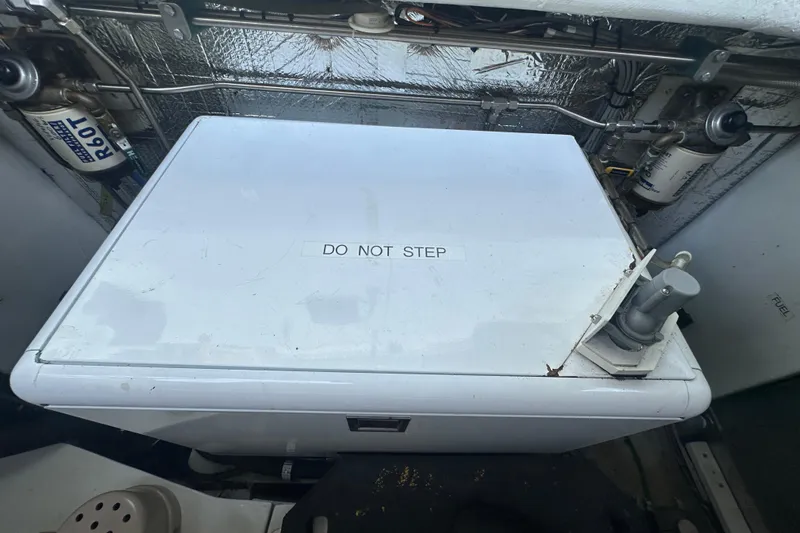 Slide: The Image of Engine compartment of 1972 Tollycraft 42 Tri-Cabin with "Do Not Step" label. - 68