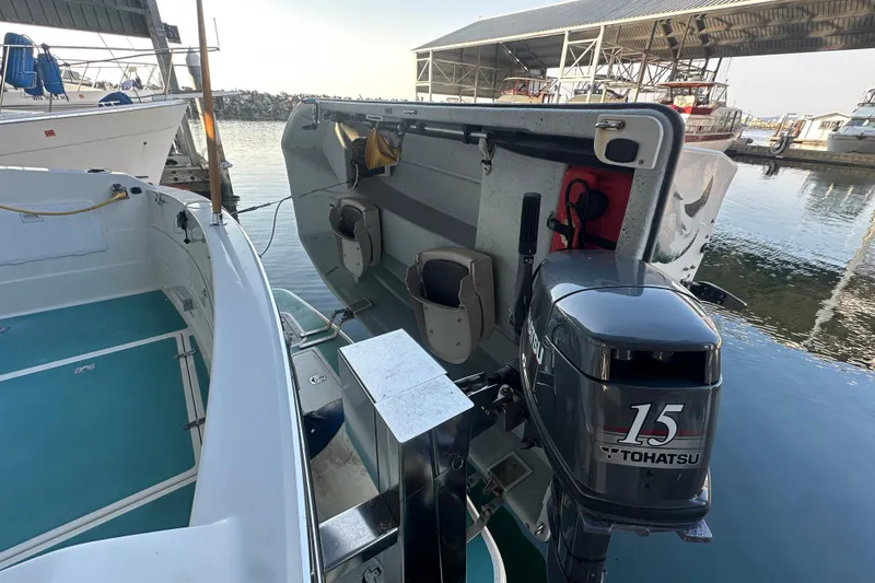 Slide: The Image of 1972 Tollycraft 42 Tri-Cabin with Tohatsu 15 outboard motor at marina. - 7